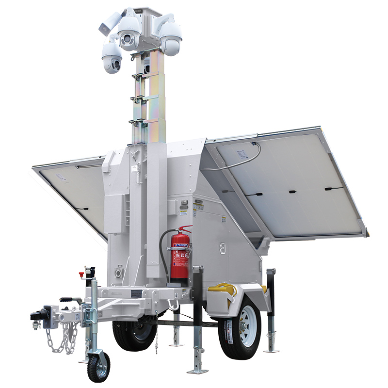 Solar surveillance tower with its mast raised, solar panels deployed and equipment cabinet closed